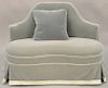 Upholstered settee having shaped back above reverse serpentine seat. lg. 49 in. Provenance: From the Estate of Deborah G. Black of G...