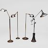 Group of Four Brass and Metal Retractable Floor Lamps