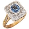 A sapphire and diamond yellow and white gold ring.