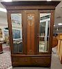 Victorian oak armoire with two mirrored doors and pewter inlay.