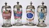 Four German colorless glass steins