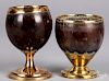 Two brass mounted coconut goblets