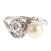 A Ladies Platinum Pearl & Diamond Bypass Ring
