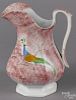 Red spatter pitcher, 19th c., with a peafowl, 10 1/4'' h.