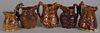 Five Rockingham type hound handled pitchers, 19th c., one stamped Harker & Taylor Co.