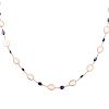A Ladies Moonstone & Sapphire Necklace in 14K