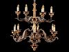 A Spanish Renaissance Style Carved Giltwood, Wrought Iron and Tôle Twelve-Light Chandelier