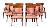 A Set of Sixteen Regency Style Parcel Ebonized Mahogany Dining Chairs