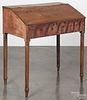 Pennsylvania painted pine work desk, 19th c., retaining remains of the original black and red surface