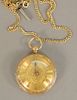 18 karat gold open face key wind pocket watch along with an 18 karat gold chain. 41mm., total weight 73.2gr.
