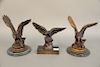 Three bronze eagles, one marked Moigniez, ht. 10 3/4 in., 10 3/4 in., 8 3/4 in.