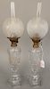 Pair of sandwich glass whale oil lamp with frosted globe shades, total ht. 19 in.