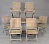 Eight piece teak set to include round dining table with one leaf, six folding armchairs, along with sunbrella large rectangular umbr...