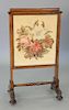 Rosewood Victorian firescreen with pull up top and sliding needlepoint panel. ht. 41 in., wd. 23 in.