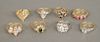 Eight 14 karat gold rings, each set with various stones, 27.8 grams.