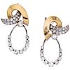 A diamond 14K yellow gold and palladium silver pair of earrings.