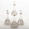 Set of Four Alvin Corporation Silver Overlay Glass Decanters and Stoppers