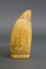 FINE DIMINUTIVE SCRIMSHAW SPERM WHALE TOOTH ATTRIBUTED TO ALBRO