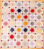 Pieced star in block quilt