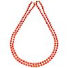 A coral necklace with 18K yellow gold clasp.