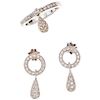 A diamond 18K white gold ring and pair of earrings set.