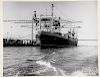 Four black and white container ship photographs