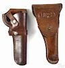 A 1911 holster, dated 1918, together with a modern Buchmeier revolver holster.