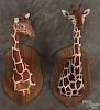 Two Louis Paul Jonas Studios composition sculptures of giraffe heads, both signed and dated 12/73