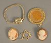 Five piece lot to include two cameo pins, one gold, 14K gold star of David pendant, 14K gold ladies wristwatch and replica Morgan dollar.