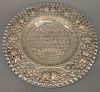 Continental silver round tray with embossed Hebrew writing and embossed flowers, dia. 17in, troy ounces: 33.5. Provenance: An Estate...
