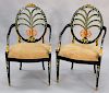 Pair of wheel back paint decorated arm chairs with prince of wales design. ht. 42 in.