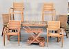 Eight piece teak set to include rectangular table, six arm chairs plus tea cart, (stained), ht. 29 1/2 in., top: 40" x 88".