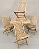 Six piece lot to include five teak bistro outdoor set, table and four chairs along with teak rocking chairs. table: ht. 29 1/2 in., top: 35 1/2" x 35 