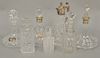 Seven crystal carafes with stoppers to include Waterford. 