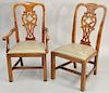 Set of six dining chairs, all with carved backs to include two arm chairs and four side chairs. 