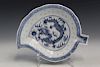 Chinese leaf-shaped blue and white porcelain dish with dragon decoration.