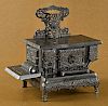 Dent cast iron and nickel The Queen toy stove,