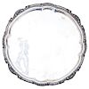 TRAY. MEXICO, 20TH CENTURY. Sterling 0.925 Silver. Brand: SANBORNS. Circular with chased strapwork. The rims embossed with vegetal decoration.