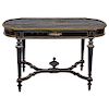 CENTER TABLE. FRANCE, CIRCA 1900. Napoleon III Style. Ebonised wood with brass, ivory and mother-of-pearl details. 