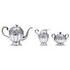 TEA SERVICE. MEXICO, 20TH CENTURY. Sterling 0.925 Silver. Brand: HIGUERAS. The body with repoussé and chased strapwork. Comprising a teapot, a sugar b