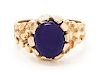 A 14 Karat Yellow Gold and Purple Hardstone Ring,