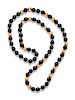 A Yellow Gold and Onyx Bead Necklace,