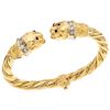 A diamond and rubies 18K yellow gold cuff bracelet.