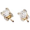 A diamond 10K yellow gold and palladium silver pair of stud earrings.