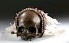 Early 20th C. Asmat Skull w/ Feathers, Beads, & Shells