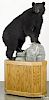 Taxidermy full-body mount of a black bear on a decorative platform base, 78'' h., 37 1/2'' l.