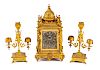 A Neoclassical Silvered and Gilt Bronze Three-Piece Clock Garniture