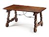 A Spanish Renaissance Revival Walnut Trestle Table