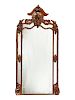 A Monumental Black Forest Carved Mirror