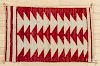 Navajo rug with a repeating triangle pattern, 20'' x 32''.